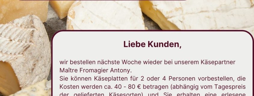 Käseangebot von Arnos Weinladen: verschiedene Käsesorten mit Trauben auf einem Brett